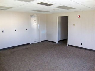 On approximately 1 acre, plenty of paved parking area.  Presently set up for office space and loading dock with overhead door in storage area, 3 Phase, all communication wiring in place and complete sprinkler system and restrooms.  Facility easily converted to manufacturing with high ceilings.  Approximately 5900 sq. ft. of space.

 - Prime Commercial/Industrial Real Estate